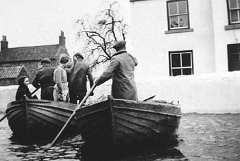 The road outside Jim Pool's farm, West Haddlesey. Barbara Pool is the young woman sitting in the boat